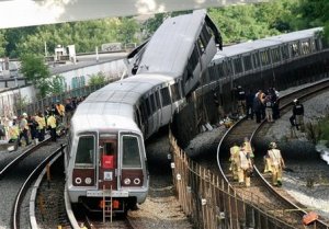 District of Columbia Fire and Emergency workers at the site of a rush-hour collision between two Metro transit trains in northeast Washington, D.C. Monday, June 22, 2009. (AP Photo/Pablo Martinez Monsivais)