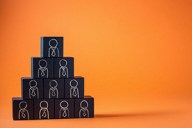 Employees are represented by wooden cubes. Business concept for